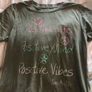 green t shirt with writing
